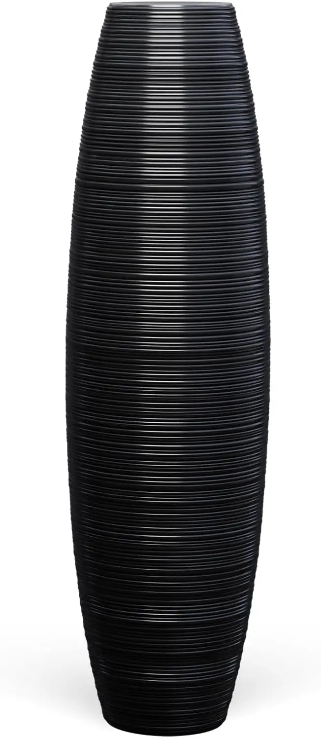 Tall floor vase, sturdy, luxurious, textured, used as a container for decorating tree branches and dried flowers