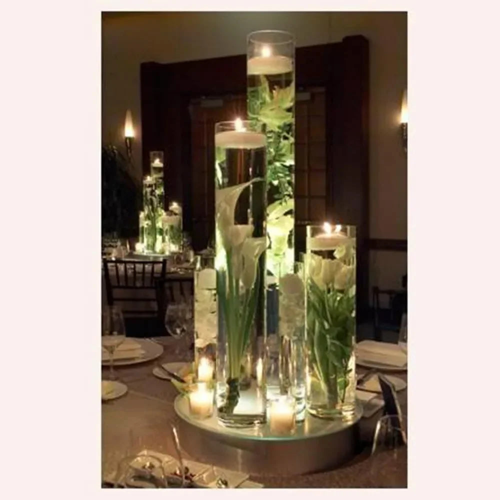 Highly transparent cylindrical glass vase, 4 inches wide x 24 inches high, featuring decorative floral tabletop displays