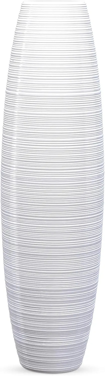 Tall floor vase, sturdy, luxurious, textured, used as a container for decorating tree branches and dried flowers