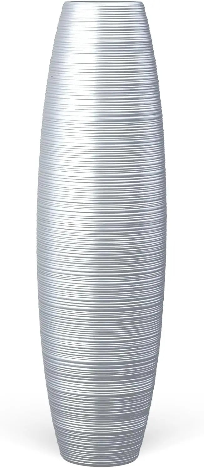 Tall floor vase, sturdy, luxurious, textured, used as a container for decorating tree branches and dried flowers